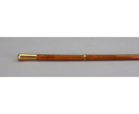 A French gold mounted walking cane, Dupuy R De La Paix 6, Paris, late 19th century, with rounded knop and engraved 'belt' mon
