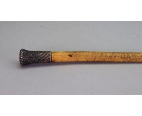 A late Victorian silver mounted walking stick, London 1896, the knop embossed with flowers and leaf scrolls, part lobed and f