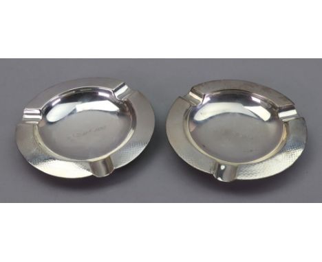 A pair of circular silver ashtrays, Chester 1915, S. Mordan &amp; Co, of heavy gauge, with engine turned borders, 7ozs, 11.5c