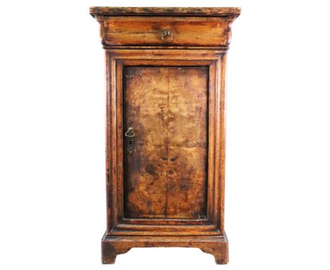 A walnut pot cupboard, first half 19th century, the crossbanded rectangular top above an ogee frieze drawer and a quarter ven