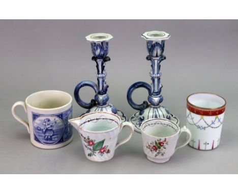 A pair of Villeroy &amp; Boch Mettlach blue and white candlesticks, with scroll handles and domed spreading bases, 18cm high,