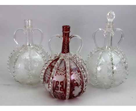 A pair of Dutch glass two handled decanters, 19th century, each bulbous body engraved with windmills, boats and fruiting vine