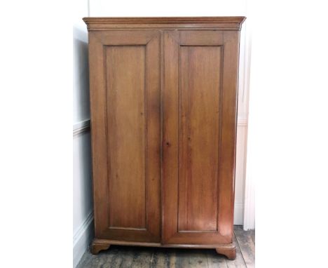 A Dutch oak cupboard, of panelled construction, circa 1880, the moulded cornice above fifteen sliding trays enclosed by a pai