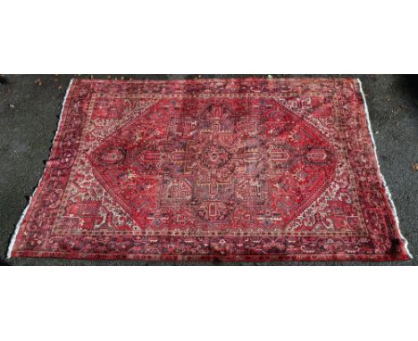 A Sarough carpet, the red ground with a large hexagonal medallion, 435cm x 319cm.