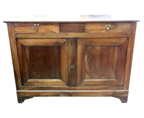 A French provincial fruitwood dwarf side cabinet, 19th century, with two shallow frieze drawers, cupboard below enclosed by a