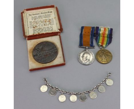 A First World War medal and Victory medal to 144535 Pte. J.W.Bizzill.Labour Corps., a boxed R.M.S. Lusitania medal, and an ov