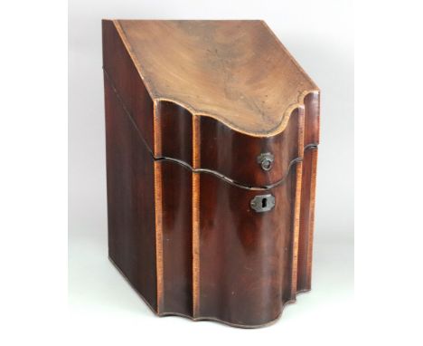 A George III mahogany tulipwood crossbanded and barber pole strung knife box, of serpentine outline, the fitted interior encl