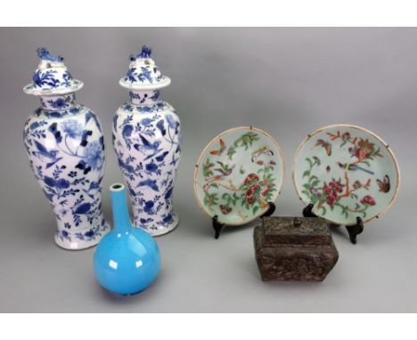 A pair of Chinese blue and white baluster vases and covers, late 19th century, painted with birds amongst flowers, four chara