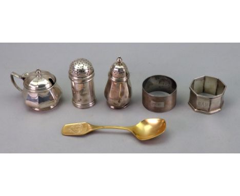 Two silver napkin rings, one engine turned, one octagonal, monogrammed, cylindrical bun top silver pepperette, Birmingham 192