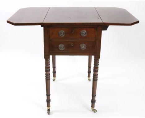 A Regency mahogany ebony strung Pembroke table, with hinged drop leaves, two end drawers, on ring turned legs and castors, 50