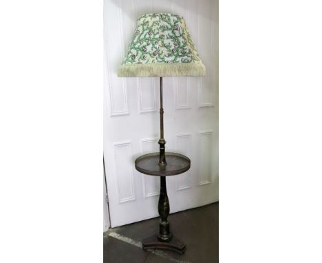A reproduction Regency style chinoiserie decorated combined standard lamp and table, gilt on a black ground, having a pierced