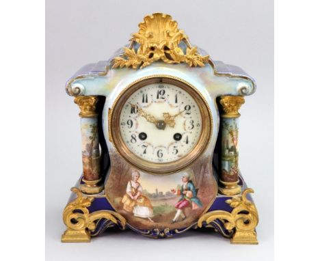 A gilt metal mounted ceramic cased mantel clock, late 19th century, of shaped outline, cobalt blue ground foliate gilded, the