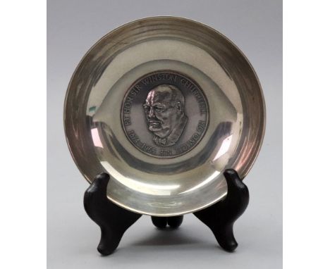 A circular silver dish, A. E. Jones, Birmingham 1965, and labelled Dunstan Silver Craft, the centre with a portrait bust of R