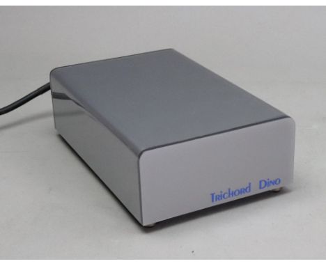 Trichord Dino Phono Pre Amplifier, serial no. 0101-4259, with an owner's manual for a Trichord Research Dino Phono Amplifier.