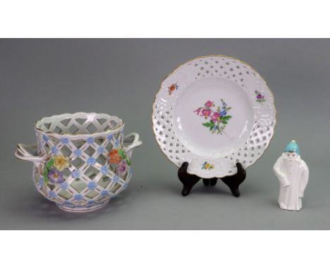 A Dresden two handled jardiniere, the trellis pierced sides applied with flowers, 19cm across, a Meissen plate, painted with 