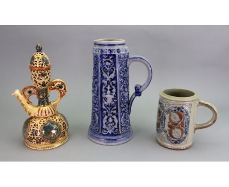 A Zsolnay Pecs earthenware double walled ewer and cover, early 20th century, pierced and painted with foliate decoration agai