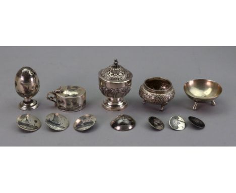 A small Indian cauldron salt cellar, late 19th century, foliate embossed and a similar pepperette, landscape and foliate embo