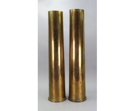 A pair of First World War brass shell cases, stamped SM1-00, 76/62, 51.5cm high.