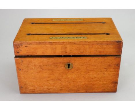 A Victorian rectangular light oak letter box, the hinged cover with two divisions and inscribed on brass plaques 'Answered' a
