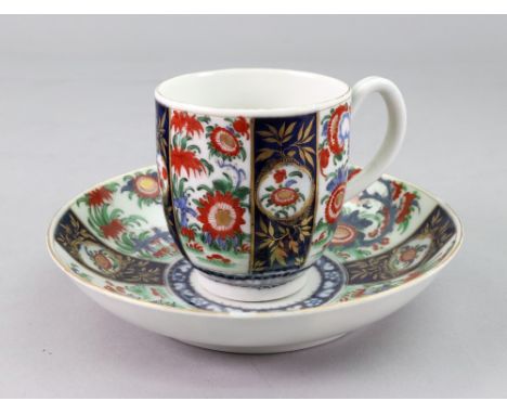 A Worcester coffee cup and saucer, circa 1780, painted with alternate segmented panels of oriental flowers and gilded (2).Ill