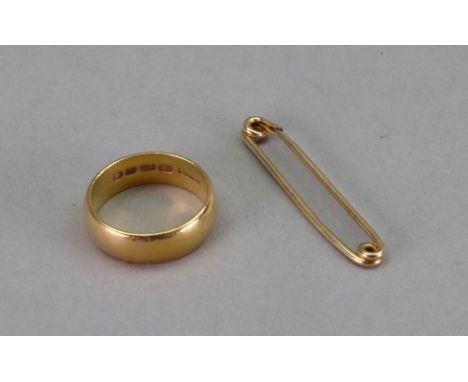 A wide 22ct gold wedding ring, 8.8g, and a wirework pin, detailed 14k, inscribed, 1g (2).