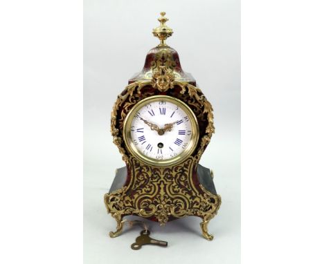 Japy Freres &amp; Co; a Louis XV style gilt metal mounted ebonised scarlet tortoiseshell and cut brass 'Boulle' marquetry man