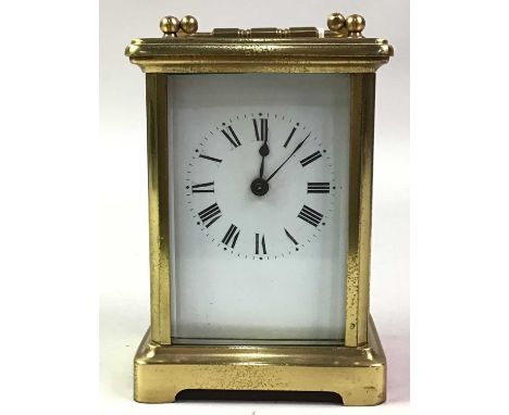 BRASS EIGHT DAY CARRIAGE CLOCK, the white enamel dial with numerals in black12cm high
