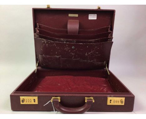 BURGUNDY BRIEFCASE, WITH CARTIER EMBLEM ALONG WITH A SATCHEL the satchel with simulated alligator skin panelsthe briefcase 43