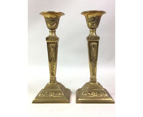 BRASS AND TOLEWARE HURRICANE LAMP, ALONG WITH FOUR PAIRS OF BRASS CANDLESTICKS the hurricane lamp with glass shade, the candl