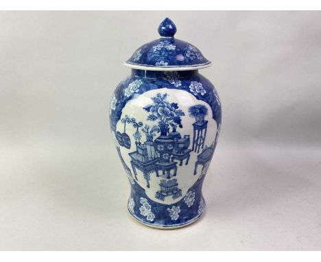 CHINESE BLUE AND WHITE BALUSTER VASE AND COVER, 19TH CENTURY decorated with two panels of various vases of flowers, on variou
