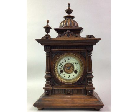 THE GREENWICH CLOCK, MANUFACTURED IN WURTEMBERG, AND A WALNUT MANTEL CLOCK  the oak clock with label, W.E.Watts, Nottingham a
