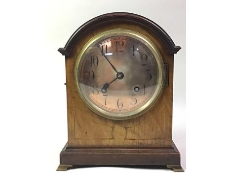 20TH CENTURY WALNUT MANTEL CLOCK, the square base on raised feet26cm high
