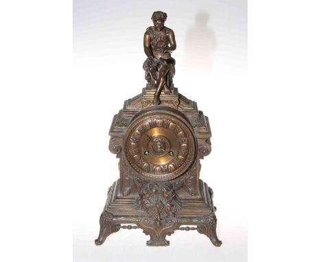 Victorian cast metal cased mantel clock, the ornate case with figure finial and scroll feet, 40cm.