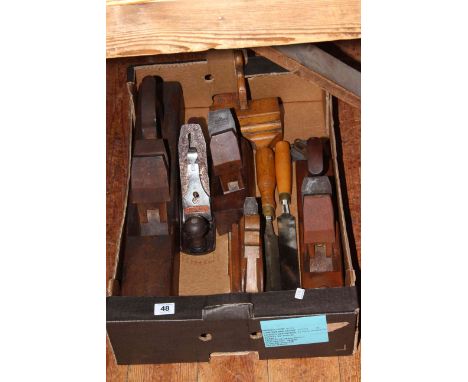 Box of planes and joinery tools.