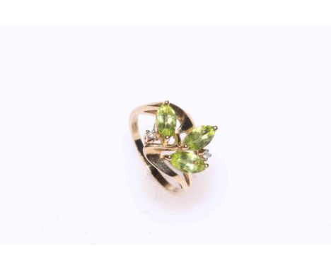 Peridot and diamond ring set in 9 carat gold, size N.