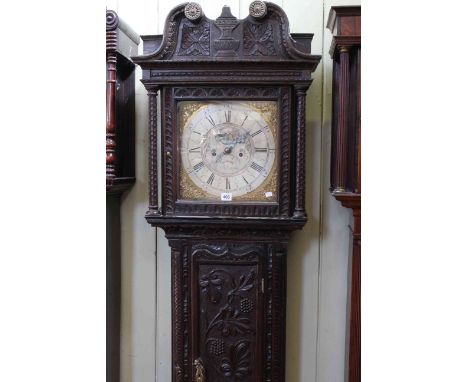 19th Century carved oak eight day longcase clock, having square brass dial with silvered chapter ring and moonphase and date 