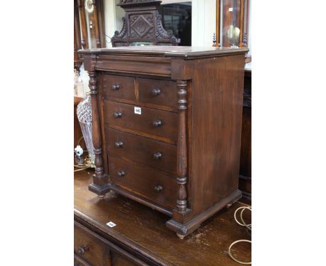 Stained miniature scotch chest of six drawers with turned pillars, 59.5cm by 50cm.
