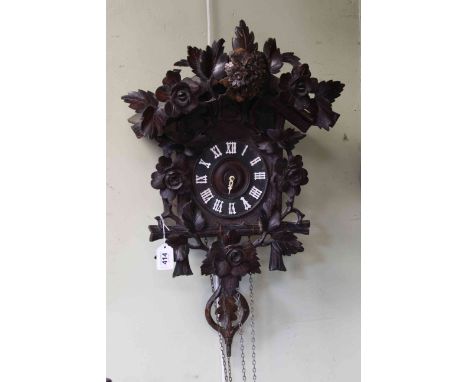 Black Forest carved Cuckoo Clock, missing weights, length including pendulum 64cm.