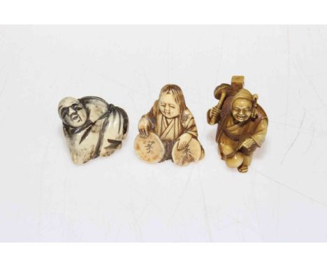 Three Japanese netsuke, one bone and two ivory.