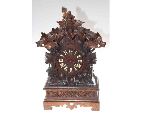 Carved wood mantel cuckoo clock, 54cm high.