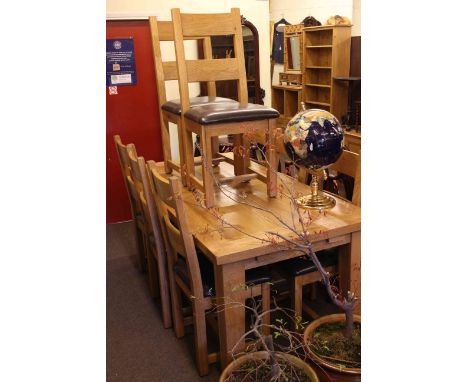 Rectangular light oak extending dining table 181cm x 90cm and eight bar back dining chairs.