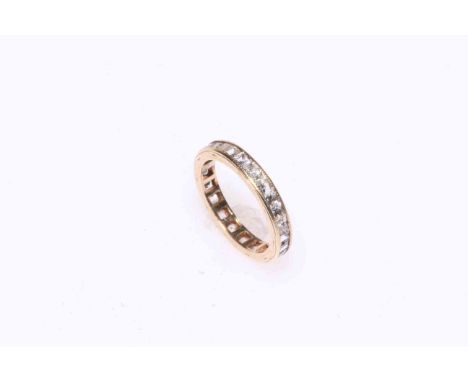 9 carat gold and white sapphire eternity ring, size H.