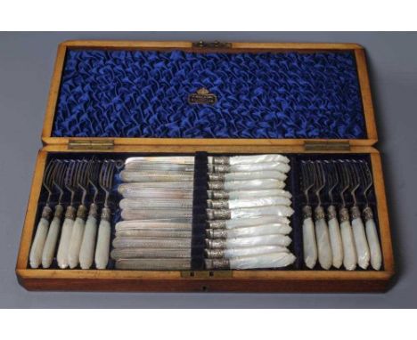 A SET OF TWELVE PAIRS OF VICTORIAN SILVER FRUIT KNIVES AND FORKS by Harrison Bros. &amp; Howson, Sheffield 1882, with engrave