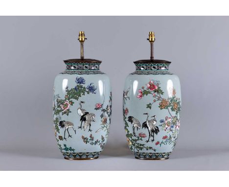 A LARGE PAIR OF CHINESE CLOISONNE ENAMEL VASES of flattened oval section, depicting pairs of cranes flying amidst flowering p