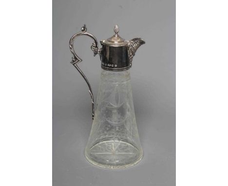 AN ELIZABETH II SILVER MOUNTED GLASS CLARET JUG of swept cylindrical form, cut and etched in the Edwardian style with baskets
