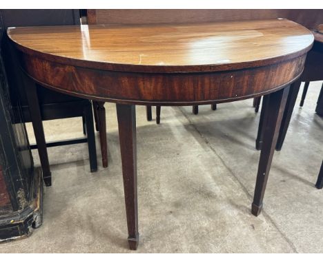 A George III mahogany demi-lune console table 