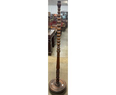 An oak bobbin turned standard lamp 