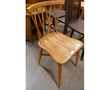 An Ercol Blonde elm and beech candlestick chair 