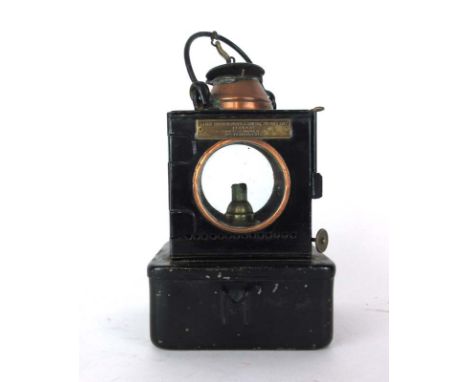 A Lamp Manufacturing and Railway Supplies Ltd. of London (L.M.S.) 'Welch Patent' tole and copper lamp, h. 24 cm 