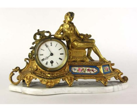 A 19th century French ormolu mantle clock surmounted by a lounging youth over painted ceramic panels on marble base, h. 24 cm